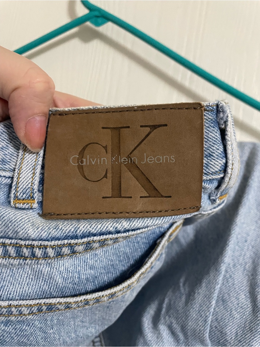 Calvin Klein Light Blue Denim Jeans with Brown Leather Patch